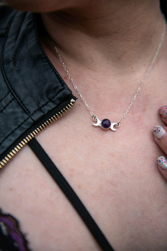 Triple moon sterling silver pendant with round deep purple amethyst center
