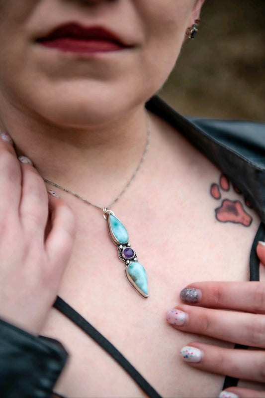 Sterling silver talisman made with two larimar tear drops and a deep purple amethyst sitting in the middle surrounded by tiny sterling silver pearls